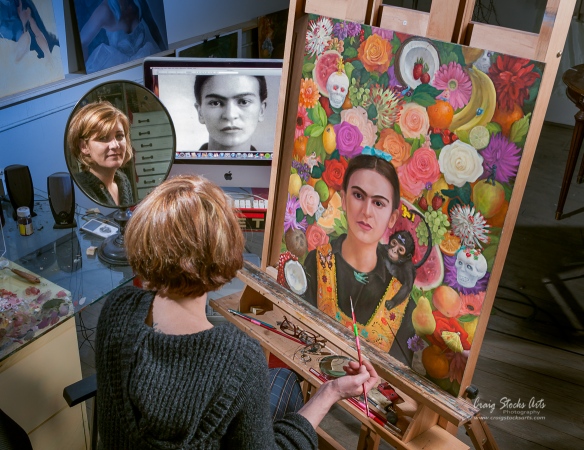 Peoria, Illinois artist Carrie Pearce in her studio working on a portrait of artist Frida Kahlo